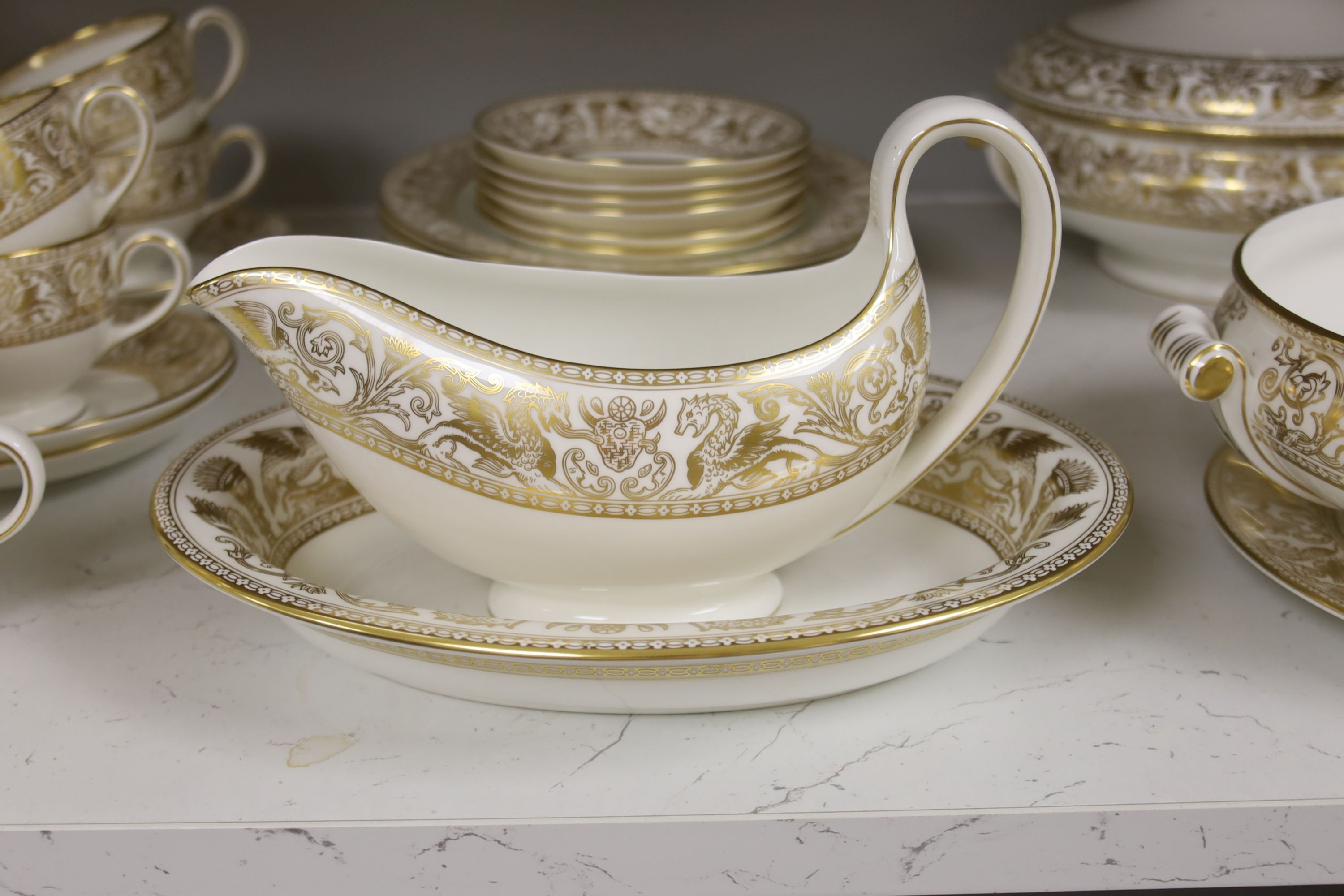 A Wedgwood Gold florentine pattern part tea coffee and dinner service